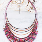 DC6401PU MULTI-STRAND LAYERED BEAD NECKLACE