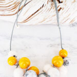 JP1103Y SMOKED RESIN BALL CLUSTER NECKLACE WITH ACCENT COLOUR