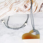 RA6003W RESIN & HORN HEART PENDANT NECKLACE