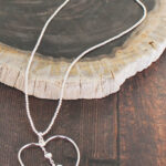 SP205 OPEN HEART PENDANT NECKLACE WITH DROP CHARMS {SILVER-PLATE]