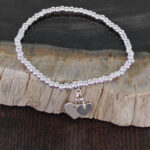 SP404H ELASTICATED BRACELET WITH HEART CHARMS [SILVER-PLATE]
