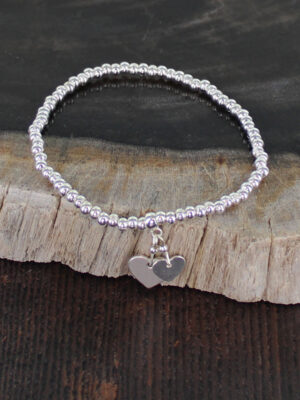 SP404H ELASTICATED BRACELET WITH HEART CHARMS [SILVER-PLATE]
