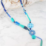 UJ1510BLU ASYMMETRIC RESIN TASSEL NECKLACE