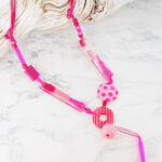UJ1510PK ASYMMETRIC RESIN TASSEL NECKLACE